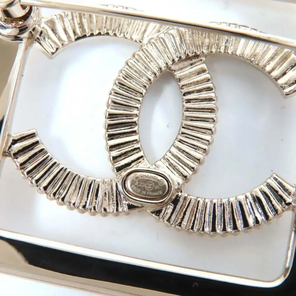 CHANEL Gold Logo Brooch